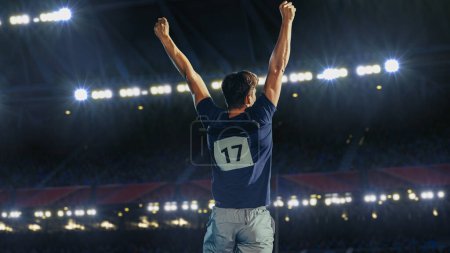 Portrait of Professional Male Athlete Happily Celebrating New Record for Winning Sport Championship. Determined Successful Sportsman Raising Arms Cheering for Gold Medal Victory.