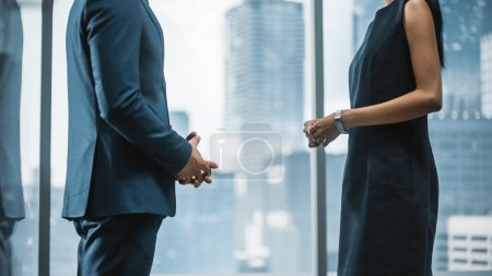Photo for Female and Male Business Partners Meet in Office, Talk. Corporate CEO and Finance Manager Have Meeting in City Office. Businesspeople Discussing Real Estate Purchase and Marketing Project. - Royalty Free Image