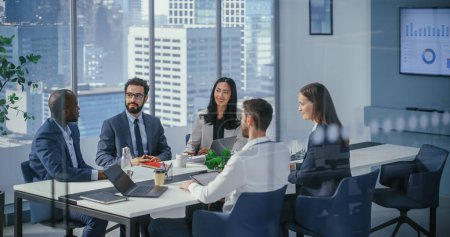 Photo for In Modern Office: Business Meeting of Black Businessman and Asian Businesswoman. Businesspeople Working on International e-Commerce Project. Negotiating, Planning, Solving Problems, Finding Solutions - Royalty Free Image