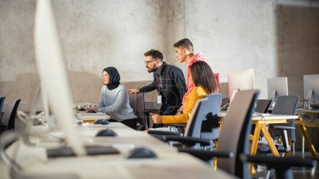 Photo for Diverse Multiethnic Group of Female and Male Students Sitting Together in Infographics Room, Collaborating on a College Project. Young Scholars - Royalty Free Image