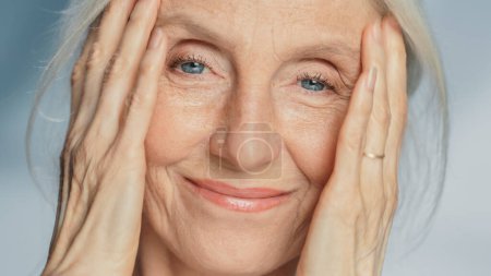 Photo for Close-up Portrait of Beautiful Senior Woman Looking at Camera and Smiling Wonderfully. Gorgeous Looking Elderly Grandmother with Natural Beauty of - Royalty Free Image