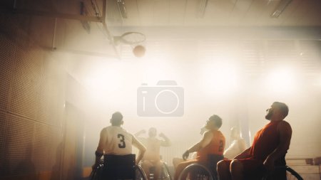 Photo for Wheelchair Basketball Game: Professional Players Competing, Passing, Shooting Ball Successfully, Score a Perfect Goal. Determination and Skill of a - Royalty Free Image