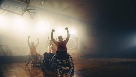 Photo for Wheelchair Basketball Game: Professional Players Competing, Shooting Ball Successfully, Score a Perfect Goal, Celebrate it with Raised Hands - Royalty Free Image