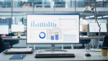 Photo for Desktop Computer Monitor with Finance Statistical Data Software and Progressive User Interface Standing on the Desk in the Modern Business Office. In - Royalty Free Image