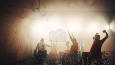 Photo for Wheelchair Basketball Game: Professional Players Competing, Shooting Ball Successfully, Score a Perfect Goal, Celebrate it with Raised Hands - Royalty Free Image