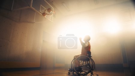 Photo for Portrait of Wheelchair Basketball Player Shooting Ball to Score a Perfect Goal. Determination, Training, Inspiration of Person with Disability - Royalty Free Image