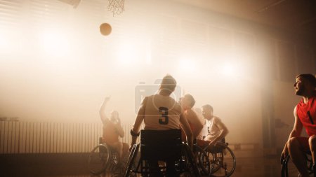 Photo for Wheelchair Basketball Game: Professional Players Competing, Fighting for a Ball, Shooting it to Score a Goal. Celebration of Determination, Skill - Royalty Free Image