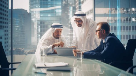 Photo for International Business Consultant Advises on Financial Strategy Plan to Successful Arab Company Owners. Multicultural Meeting in Modern Office Between - Royalty Free Image