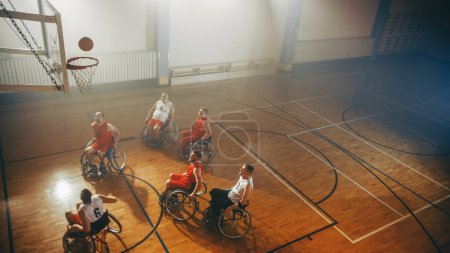 Photo for Two Team Wheelchair Basketball Game on Professional Court. Paraplegic Players Compete, Shoot, Score Goal Points. Determination, Skill of People with - Royalty Free Image