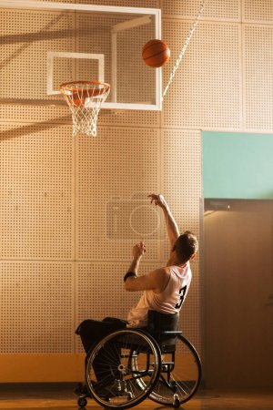 Photo for Wheelchair Basketball Player Shooting Ball to Score a Goal Like a Professional. Determination, Motivation of a Person with Disability Excelling at - Royalty Free Image