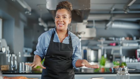 Photo for TV Cooking Show Restaurant Kitchen: Black Female Chef Talks, Teaches How to Cook Food. Online Video Class, Streaming Service, e-Learning Video Course - Royalty Free Image