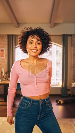 Vertical Screen: Beautiful Young Black Female Record a Dancing Routine on a Smartphone Video for Social Media. Stylish Latin Girl Streaming Her