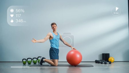 Fitness Course Video Tutorial with Young Athletic Personal Trainer Explaining Strengthening Workout with Plank Position on a Ball. Fit Man Showing How