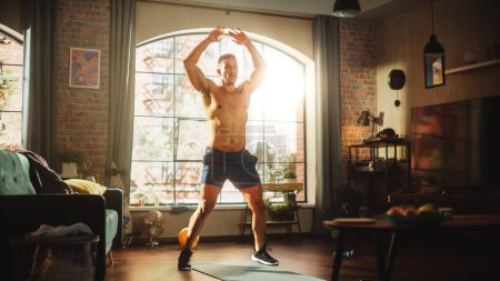 Portrait of a Strong Athletic Black Man Doing Shirtless Workout at Home, Jumping Jacks. Fit Muscular Sportsman Staying Healthy, Training, Exercise