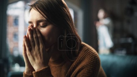Foto de Portrait of Sad Crying Woman being Harrased and Bullied by Her Partner. Couple Arguing and Fighting Violently. Domestic Violence and Emotional Abuse - Imagen libre de derechos