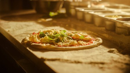 In Restaurant Professional Chef Preparing Pizza, Kneading Dough, flouring it, Traditional Family Recipe. Authentic Sunny Pizzeria, Cooking Delicious