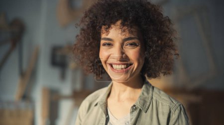 Close Up Portrait of a Multiethnic Brunette with Curly Hair and Brown Eyes. Happy Creative Young Woman Charmingly Smiling and Feeling Joyful. Thinking