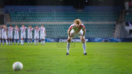 Major League Soccer Football Championship. Confident White Team Forward Player Prepares to Score a Goal, Teammates In Line Up Behind Him. Live Sports