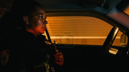 Inside Police Traffic Patrol Squad Car: Black Female Police Officer on Duty, Receives Emergency Scanner Radio Call from Center Dispatcher, Responds