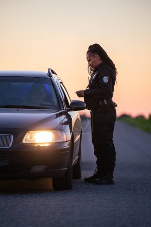 Highway Traffic Patrol Car Pull over, routine Check, Road Inspection Stop. Professional Black Female Police Officer Approaches Vehicle, Asks Driver