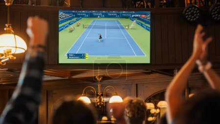 Group of Tennis Fans Watching a Live International Broadcast in a Sports Bar on TV. People Cheering, Supporting Their Player. Crowd Goes Ecstatic When