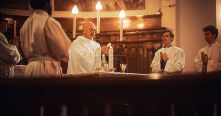 The Eucharist Service In Grand Church: Ministers of Christian Faith lead The Ceremony that Involves Sharing Bread in Honor of Jesus Christ. Holy