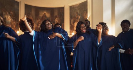 Black Christian Gospel Singers in Church Clapping and Stomping, Praising Lord Jesus Christ. Warm Atmosphere in Church Thanks to Energetic Choir