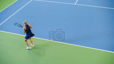 Photo for Female Tennis Player Just Served by Hitting Ball with a Racquet During Championship Match. Professional Woman Athlete Successfully Strikes. World - Royalty Free Image