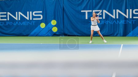 Photo for Female Tennis Player Hitting Ball with a Racquet During Championship Match. Technical Woman Athlete Receives and Lands Perfect Volley Shot. World - Royalty Free Image