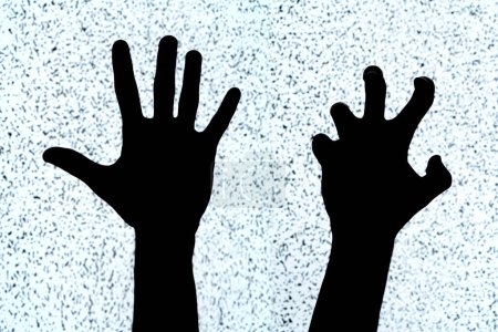 Photo for Two hands on a white noise TV screen background, black silhouettes, shapes. Scary creepy hand gestures, bent fingers, horror, simple symbol, cut out, aggression, evil, distress abstract concept - Royalty Free Image