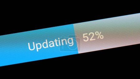 Photo for Generic updating system update process bar percentage meter on display, around 50 percent file transfer upload download progress macro extreme closeup screen detail, nobody, no people, technology - Royalty Free Image