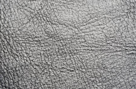 Extremo primer plano fondo textura detalles de material de cuero agrietado artificial, líneas y pliegues patrón en toda la superficie, visto desde arriba, vista frontal, materiales de alta calidad, cartera, ropa