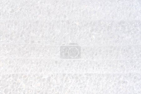 Close-up view of white packaging polyurethane foam material structure high resolution background texture up close, backdrop simple protective material for shipping and handling abstract concept nobody