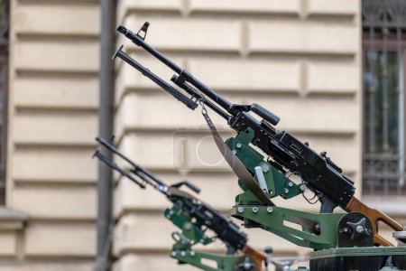 Closeup of a collection of vehicle-mounted machine guns with barrels pointing up, nobody. Urban warfare operations city war symbol, abstract concept no people, news shot. Conventional weapons up close