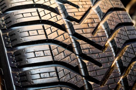 Photo for Winter tyre showing surface detail and pattern of tread. - Royalty Free Image
