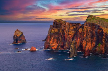 Sunset over colorful cliffs of Ponta de Sao Lourenco peninsula on Madeira Island, Portugal.