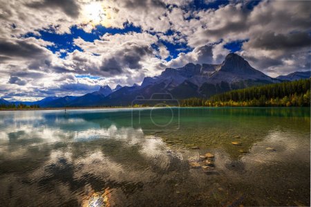 Rundle Forebay Reservoir in Canmore, Canada, with Rundle Mountain in the background.