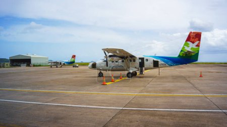 Photo for Mahe, Seychelles - February 13, 2022: Air Seychelles small propeller aircraft at Mahe airport. This aircraft is used for flights to the island of Praslin. - Royalty Free Image