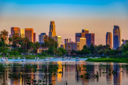 City skyline of Los Angeles downtown in California during sunset from Echo Park with swan pedal boats on the lake
