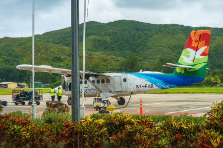 Photo for Mahe, Seychelles - February 13, 2022: Air Seychelles small propeller aircraft at Mahe airport. This aircraft is used for flights to the island of Praslin. - Royalty Free Image