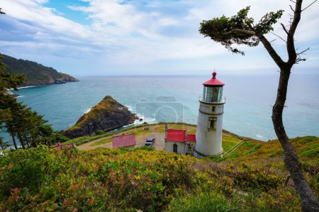 Photo for Heceta Head Lighthouse located along the scenic Oregon coast. It is a stunningly picturesque and historic beacon set atop a rugged cliff, offering views of Pacific Ocean and surrounding landscapes. - Royalty Free Image