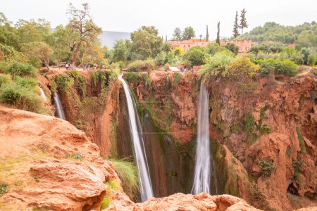 Photo for A view of the top of the Ouzoud Waterfalls in Morocco, Africa. People can be seen at the top - Royalty Free Image