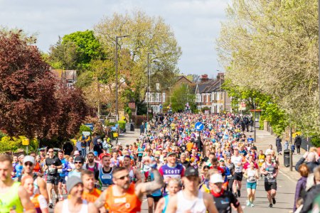 Photo for LONDON, UK - 21ST APRIL 2024: Large amounts of people running in the London Marathon 2024 mass run - Royalty Free Image