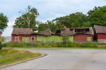 Photo for Old red barn with a collapsed roof. - Royalty Free Image