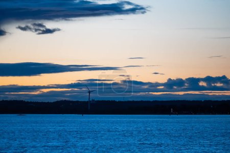 Photo for Wind power plant silhouette on a late summer night. - Royalty Free Image
