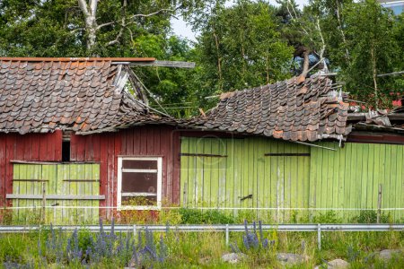 Photo for Old red barn with a collapsed roof. - Royalty Free Image