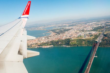 Photo for Lisbon, Portugal - July 20 2016: View over Almada while arriving by airplane. - Royalty Free Image