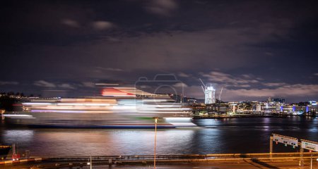 Photo for Gothenburg, Sweden - november 28 2021: Long exposure photo of a Stela Line ferry leaving Gothenburg at night. - Royalty Free Image