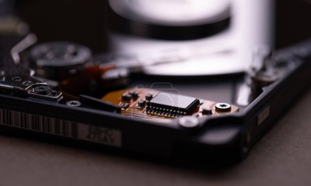 Photo for Mechanics inside a hard disk drive with platter and read write head. - Royalty Free Image