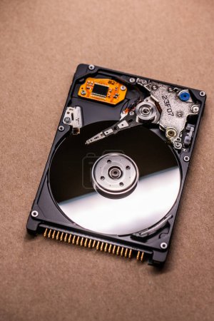 Photo for Mechanics inside a hard disk drive with platter and read write head. - Royalty Free Image